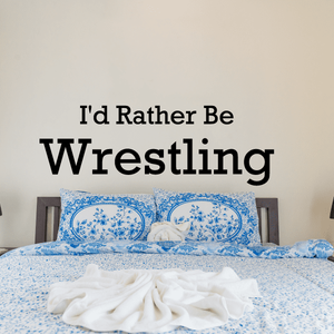 Wall decal text: “I'd Rather Be Wrestling” in large black lettering