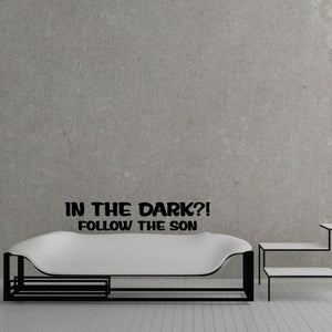 Wall decal with black text: “IN THE DARK?! FOLLOW THE SON”