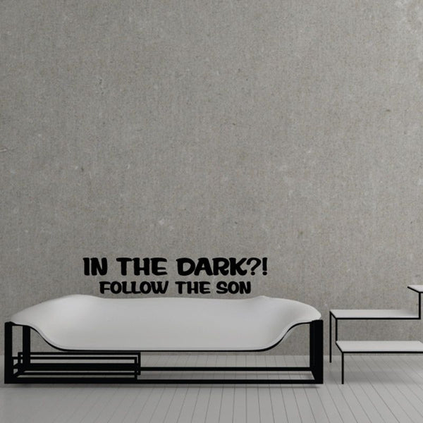 Wall decal with black text: “IN THE DARK?! FOLLOW THE SON”