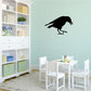 Black crow silhouette wall decal with wings spread and legs forward