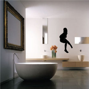 Black silhouette decal of a nude woman sitting