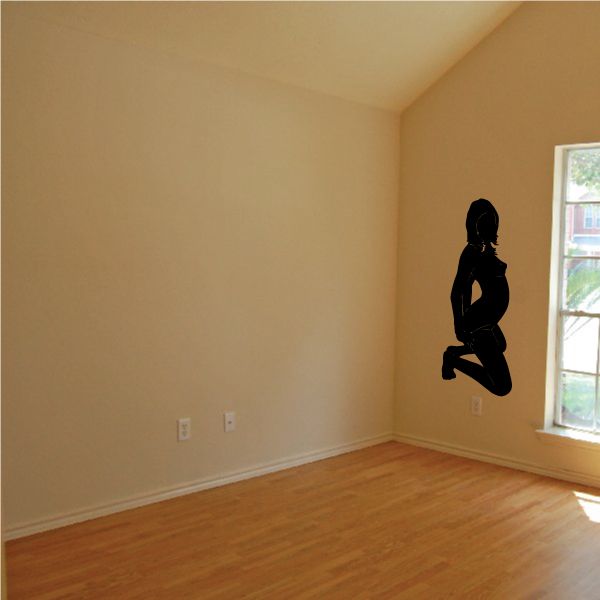 Kneeling woman silhouette wall decal, dark black figure