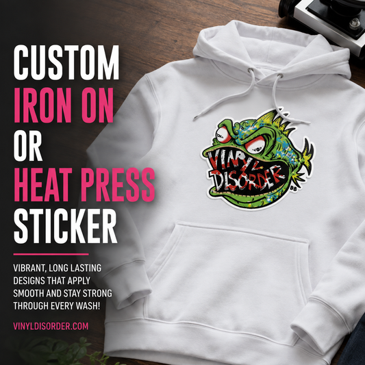 Custom iron-on or heat-press sticker on white hoodie, colorful graphic dinosaur logo.
