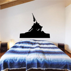 Black Iwo Jima wall decal silhouette of soldier raising a flag above a rifle.