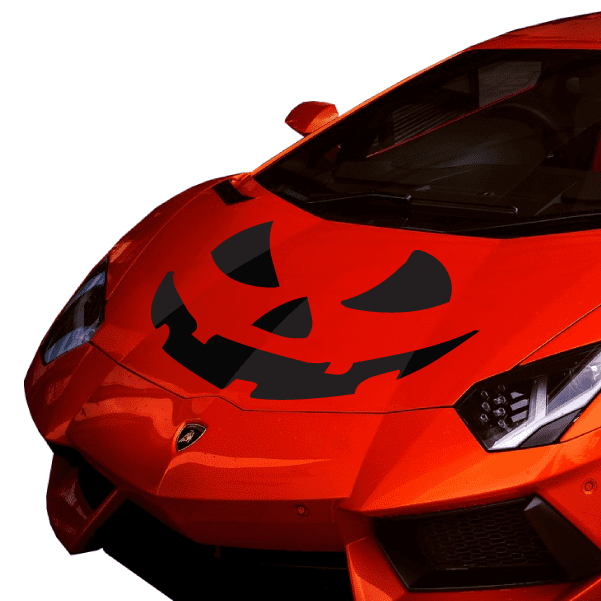 Jack-O-Lantern face magnet on red surface with pumpkin grin