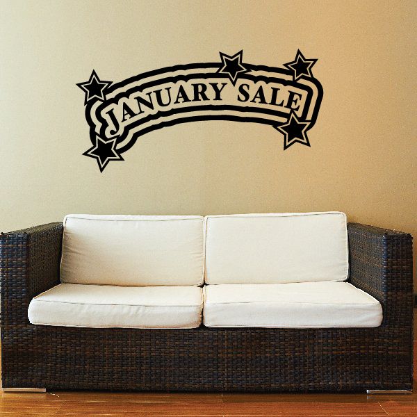 January Sale wall decal with black ribbon text and four star accents