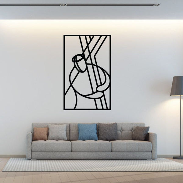 Black outline wall decal of Jesus bearing a cross in a square frame