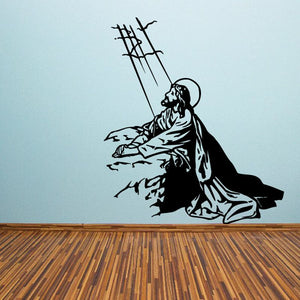 Religious Jesus resurrection wall decal: black kneeling figure with cross silhouette