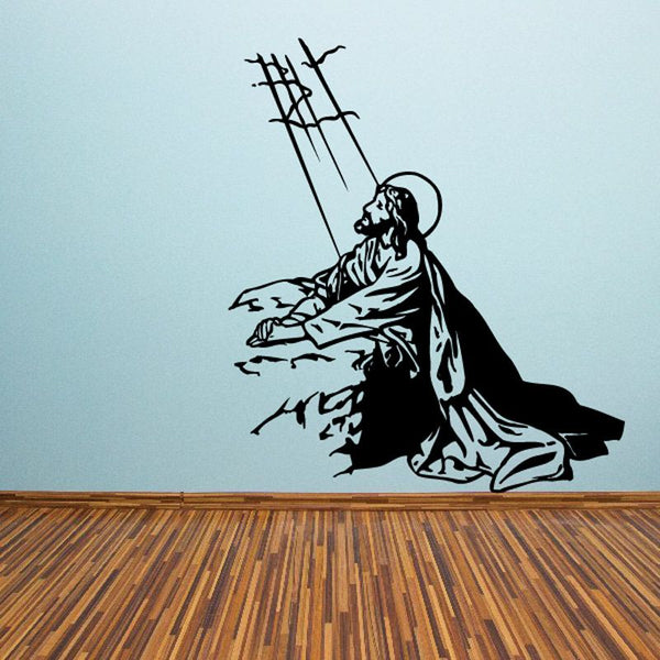 Religious Jesus resurrection wall decal: black kneeling figure with cross silhouette