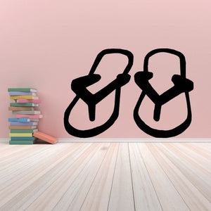 Sandals decal with two black sandal outlines, open toe and ankle straps.