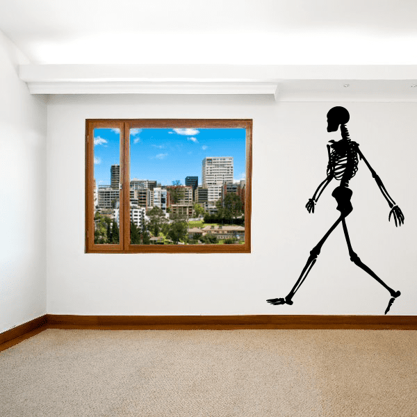 Jogging skeleton wall decal, black silhouette with raised arms and legs