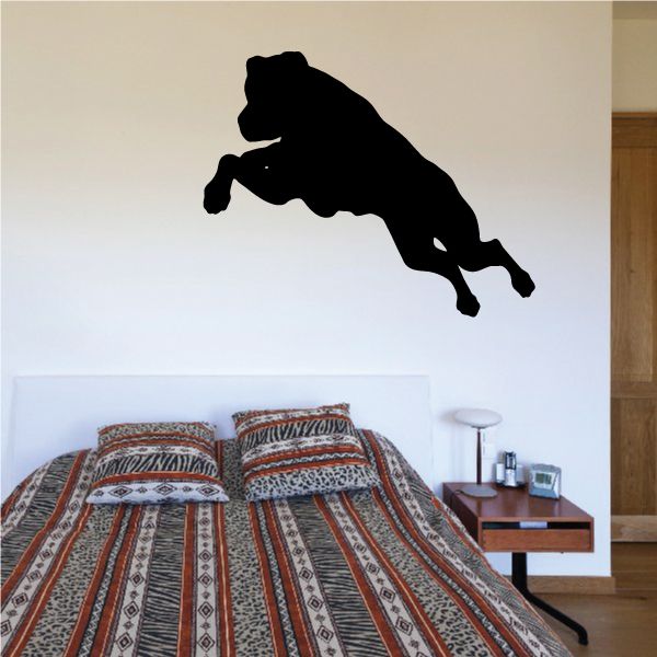Jumping Rottweiler decal of a black dog silhouette mid-jump