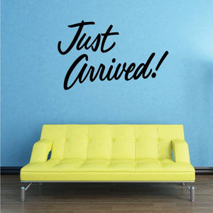 Vinyl wall decal with black Just Arrived script lettering