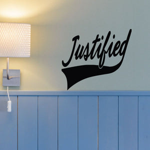 Black Justified script wall decal with curved banner bottom