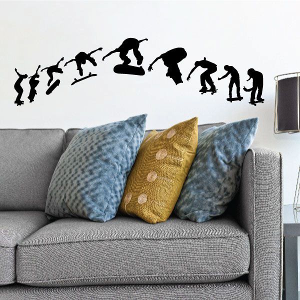 Skateboarding decal set with black silhouettes of kickflip trick figures