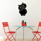 Black owl wall decal with tilted head, round eyes, and small feet
