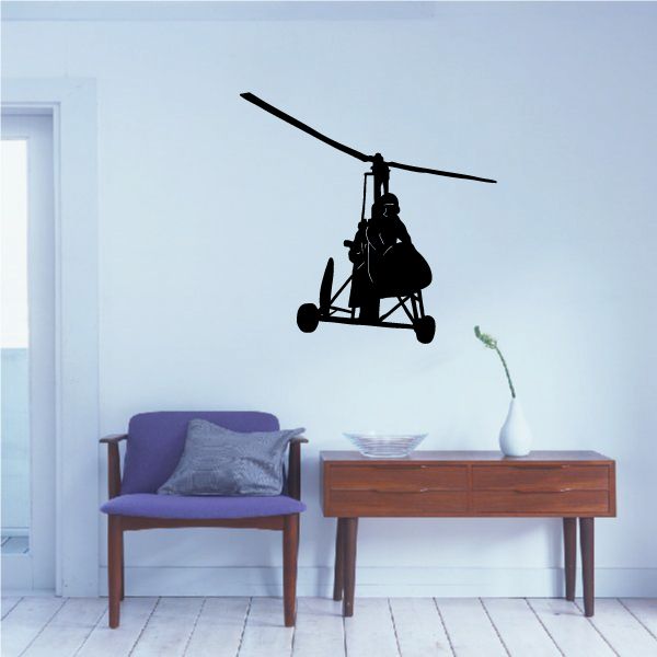 Black helicopter wall decal with spinning rotor and seated pilot silhouette