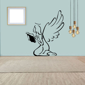 Kneeling angel reading bible wall decal with black outline