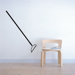 Large black rake wall decal with long handle and curved tines