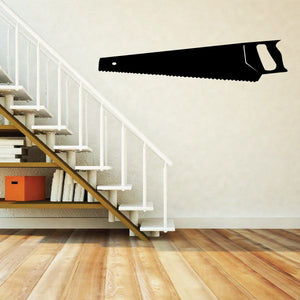 Black hand saw wall decal with serrated blade and wood-grip handle