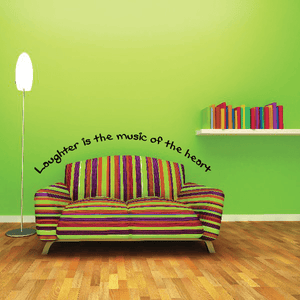 Wall decal with curved quote "Laughter is the music of the heart" in black
