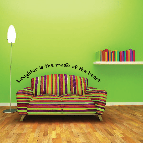 Wall decal with curved quote "Laughter is the music of the heart" in black