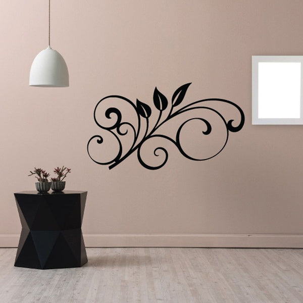 Black laurel swirl wall decal with curling scrolls and leaf accents