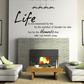 Wall decal with black cursive quote: “Life… moments that take our breath away.”