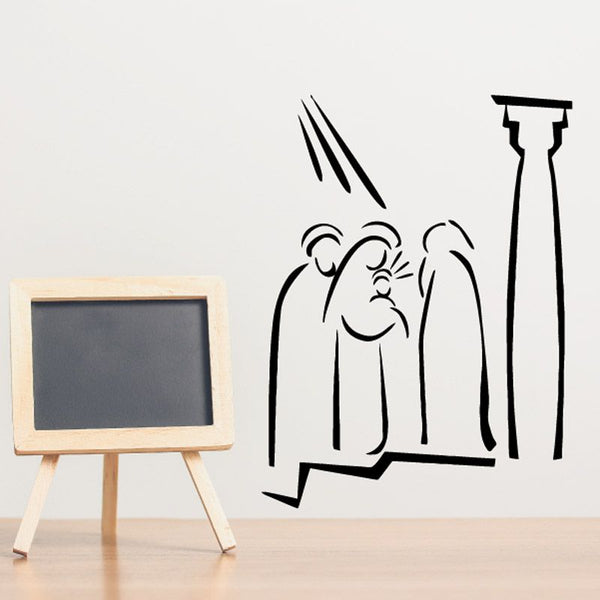 Black line art wall decal of baby Jesus with light rays and chalkboard sign
