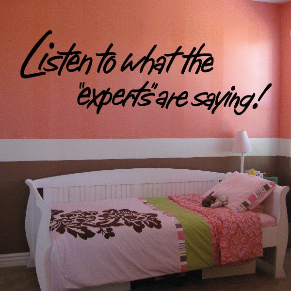 Black cursive wall decal quote: “Listen to what the experts are saying!”