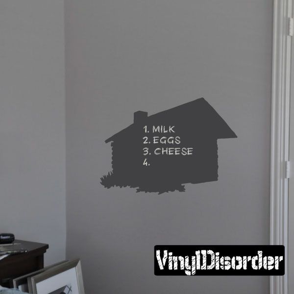 Log cabin chalkboard decal shaped like a house with chalk list: Milk, Eggs, Cheese, Eggs.