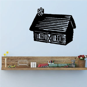 Black log cabin wall decal with white window and roof details