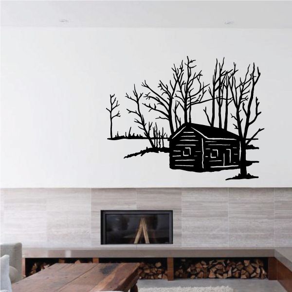 Black log cabin wall decal with leafless trees and stone chimney