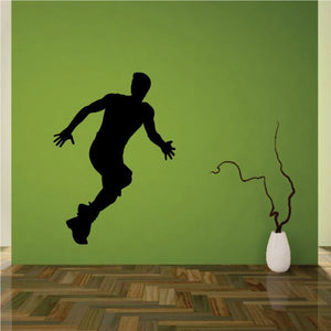 Male runner wall decal silhouette, athletic pose and outstretched arms.