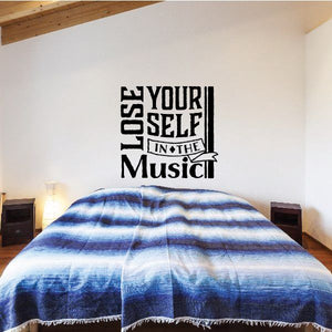 Music wall decal reading “Lose Yourself In The Music” in bold black lettering