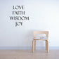 Wall decal with words LOVE, FAITH, WISDOM, and JOY in black lettering