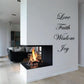 Wall decal with the words Love, Faith, Wisdom, and Joy in black cursive lettering