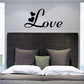 Love hearts wall decal with black cursive lettering and small heart icons
