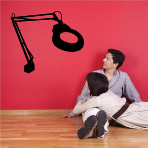 Magnifier wall decal with magnifying glass and stand, black silhouette
