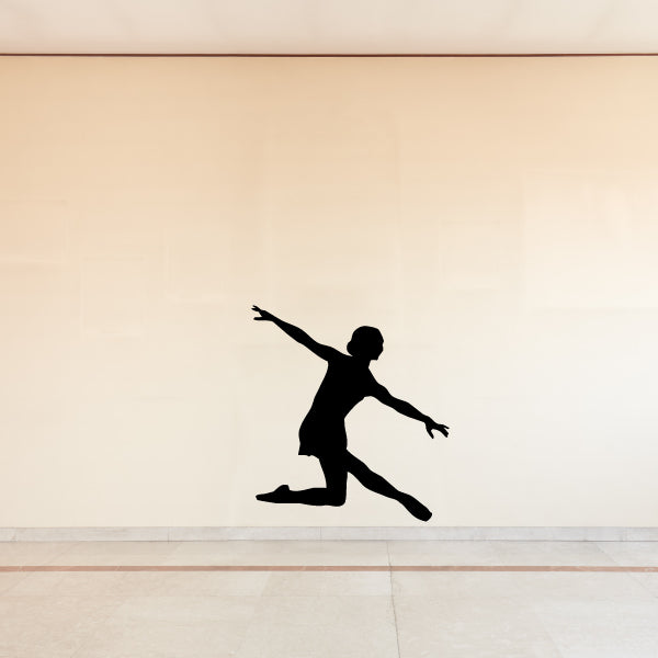 Ballet dancer wall decal featuring a black silhouette mid-leap with bent leg