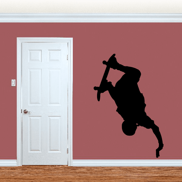 Black skateboarding decal sticker with silhouetted rider mid-grind