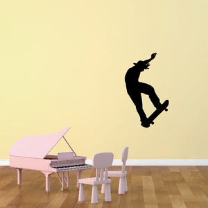 Black skateboarder silhouette decal for wall, featuring a trick pose