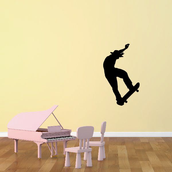 Black skateboarder silhouette decal for wall, featuring a trick pose