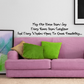 Wall decal with black cursive quote text above couch: joy, laughter, window opens.