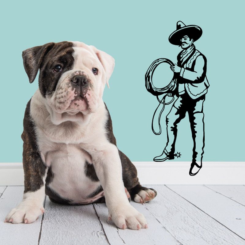 Rodeo cowboy vinyl wall decal holding a barrel, black outline on light background