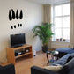 Moose track wall decal with three black track shapes for walls