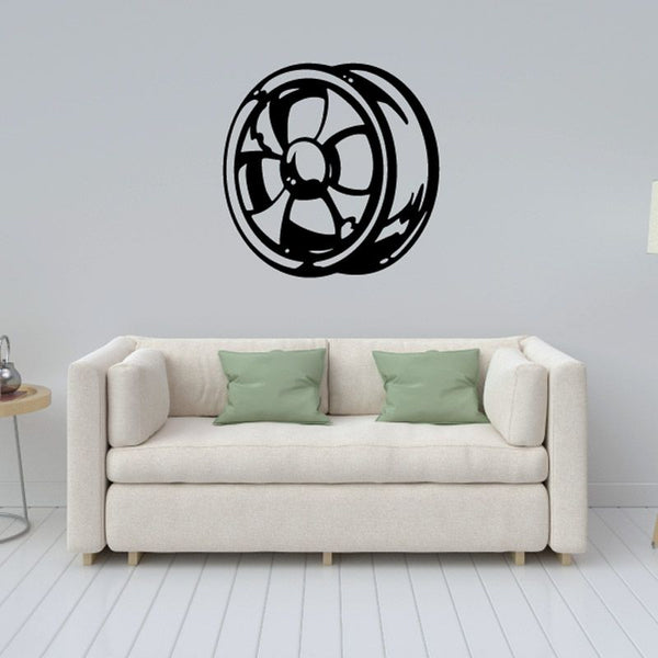 Motorcycle gear wall decal: black circular emblem with winged center.