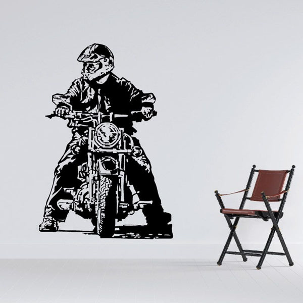 Black motorcycle rider sketch wall decal with helmet, on front-facing bike