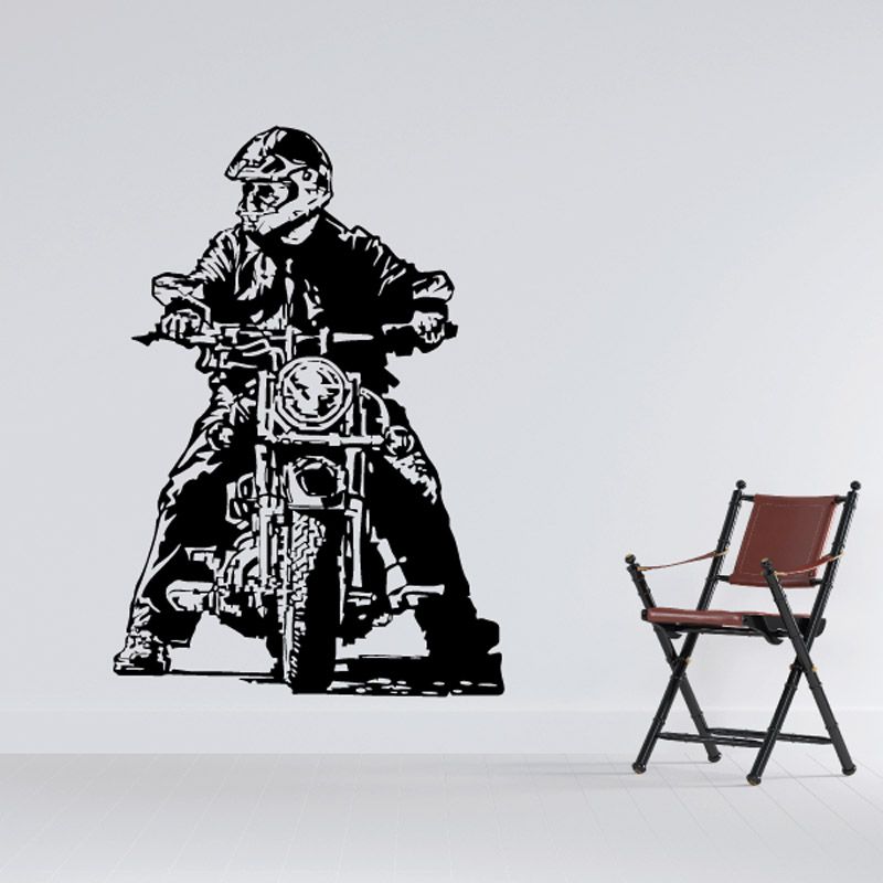 Black motorcycle rider sketch wall decal with helmet, on front-facing bike