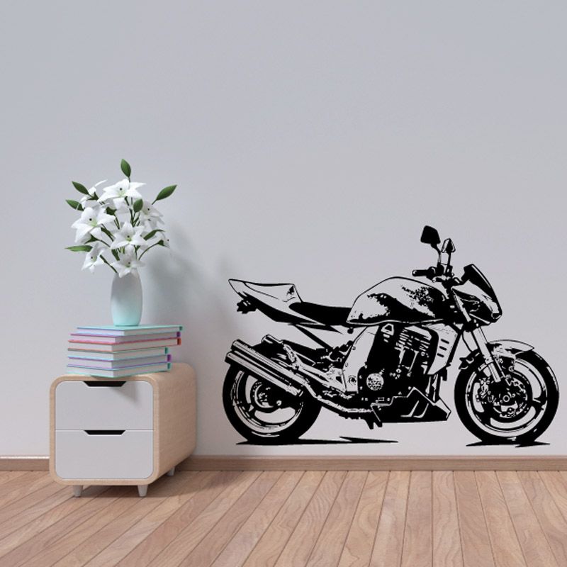 Motorcycle wall decal, black vinyl sketch of bike with wheels and exhaust, flat on wall.